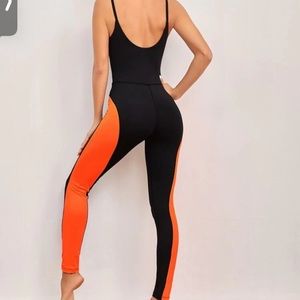 Neon orange and black jumpsuit.